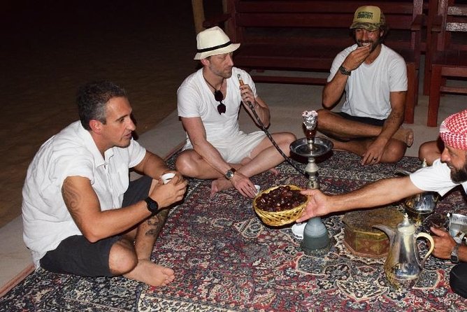 Abu Dhabi Evening Desert Safari with BBQ Dinner and all Camp Activities - BBQ dinner under the stars and belly dancing show