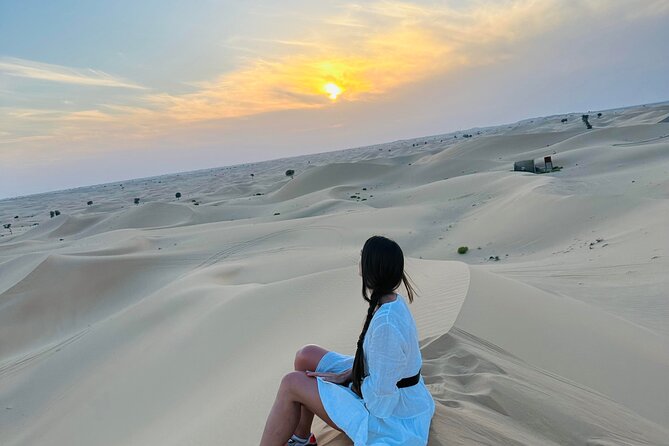Abu Dhabi: Evening Desert Safari with Camel Ride, BBQ & Live Show - The camel farm stop: hands-on animal time before camp lights up