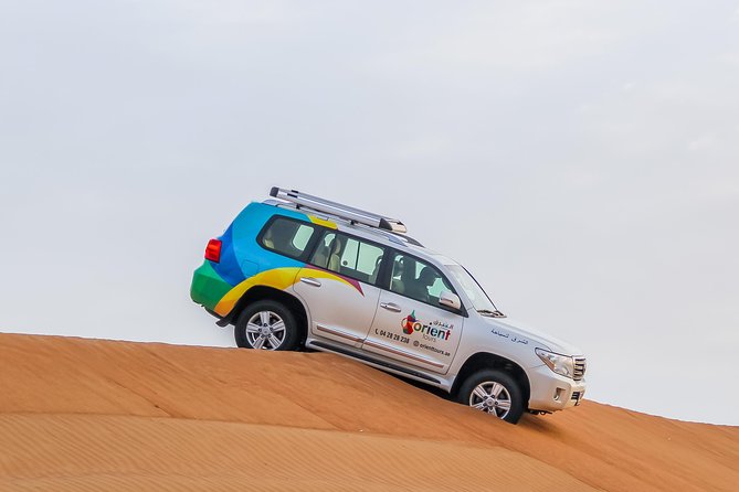 Classic Dubai Desert Safari with BBQ Dinner and Camp activities - Dune Bashing in a 4x4: The Jolt, the Safety, and What to Wear