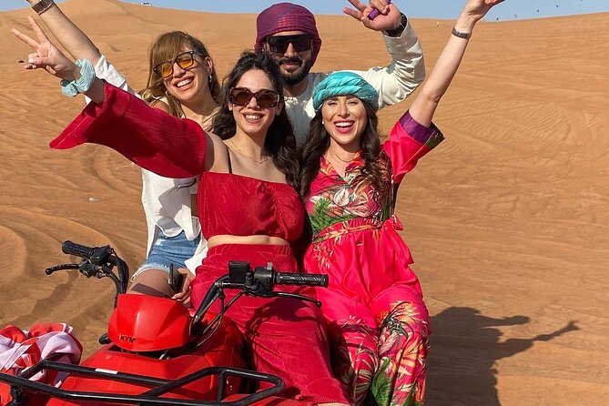 Combo:Deluxe Desert Safari with dinner + ATV self-drive/Quad Bike - Entering the Deluxe desert camp: gahwa, sweets, henna, and a falcon photo