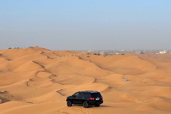 Desert safari adventure with BBQ dinner - Dune bashing in the sand: short, intense, and built-in