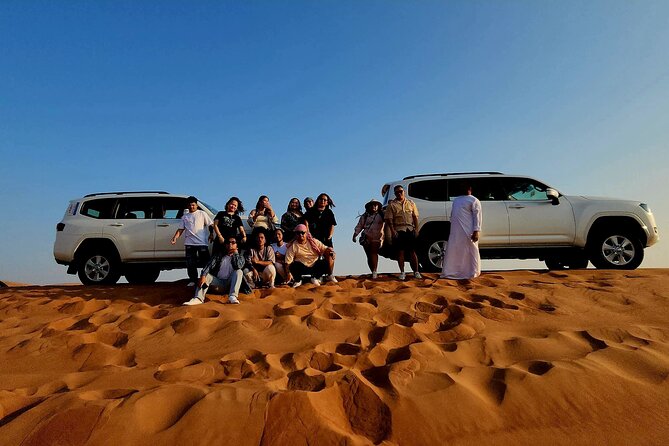 Desert Safari Adventures: Dune Bashing, Camel Rides, and BBQ, ATV - Dune Bashing: Red Dunes, Photo Stops, and Adrenaline Control