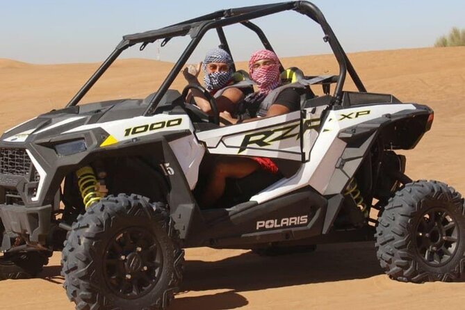 Desert Safari Dubai at Evening with BBQ Dinner - Desert Camp welcome: gahwa, sweets, camel ride, and henna