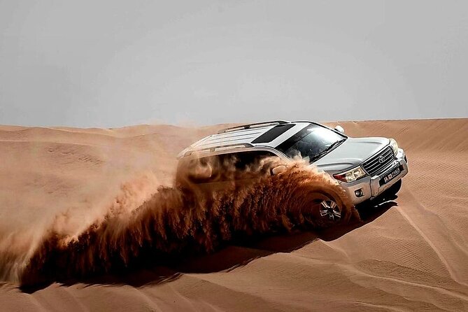 Desert Safari Dubai High Red Dunes, Camel Ride, BBQ At Camp - Dune Bashing, Sandboarding, and a Short Camel Ride