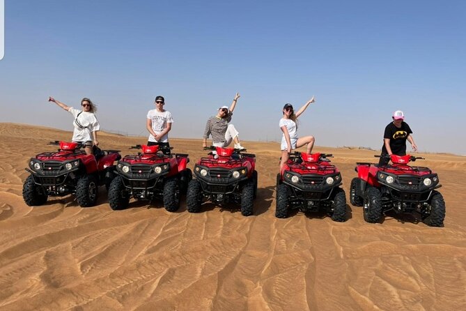 Desert Safari Dubai & Quad Bike with Dinner - Camel rides and sandboarding before the evening shows