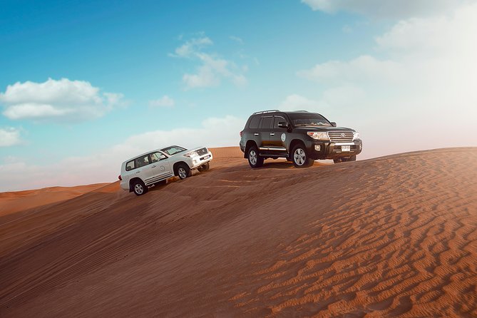Desert Safari Dubai with Dune Bashing, Sandboarding, Camel Ride, 5 Shows, Dinner - 4x4 Dune Bashing: the 25–30 minute thrill ride