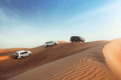 Desert Safari Dubai with Dune Bashing, Sandboarding, Camel Ride, 5 Shows, Dinner - Sandboarding and Camel Ride: what you actually do in the sand