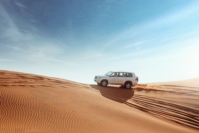 Desert Safari Dubai with Dune Bashing, Sandboarding, Camel Ride, 5 Shows, Dinner - Common logistics pitfalls: pickup delays and shortened activity time