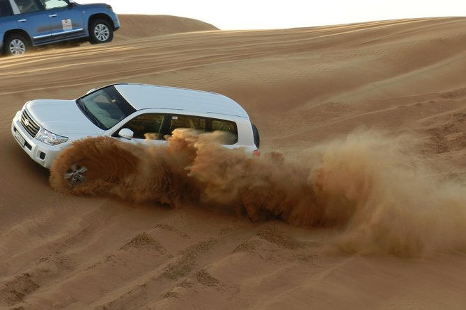Desert safari in Dubai Red Dunes with BBQ VEG Dinner & Quad Bike - Dune Bashing in a Land Cruiser: The Thrill (and the Reality Check)