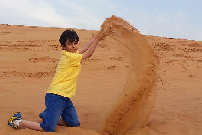 Desert Safari Tour, Quad Bike with BBQ Dinner & Show from Dubai - Sandboarding and the sunset photo stop: when the desert looks its best