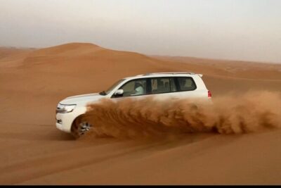 Desert Safari Tour with Camel Ride and BBQ Dinner in VIP Camp - Lahbab Pickup to the Dunes: The 4x4 Journey and Dune Bashing Rush