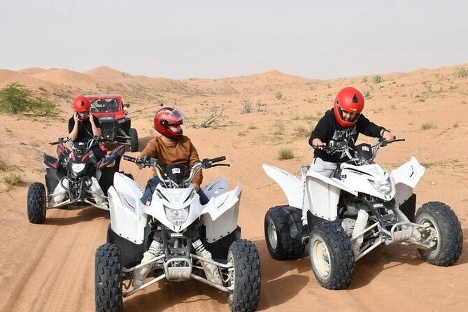 Desert Safari W/BBQ Dinner, Quad Bike, Camel Ride, & Sandboarding - Dune bashing: adrenaline sand driving with a steady hand