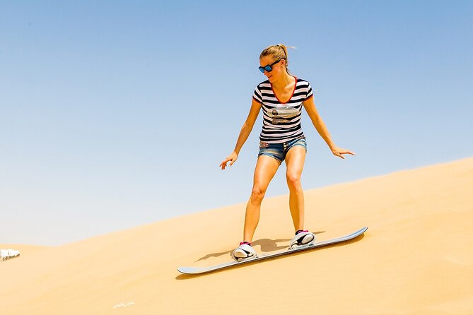 Desert Safari with BBQ Dinner, Camel Ride, Sand Board & Live Show - The Desert Action: Dune Bashing and Optional Quad Biking