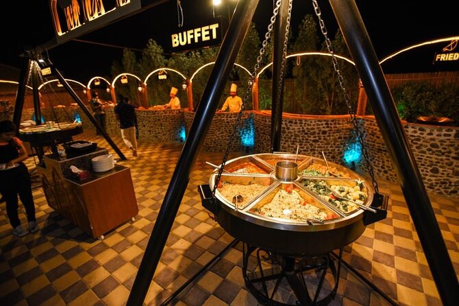 Desert Safari With BBQ Dinner, Quad Bike & Camel Ride from Dubai - BBQ dinner on pillows and carpets: the meal is part of the show