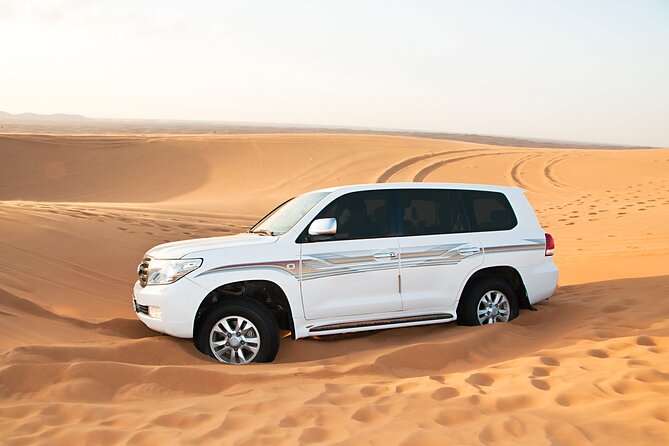 Doha Desert Safari Dune Bashing Camel Ride Sandboarding - Sandboarding: a short activity that adds a big smile