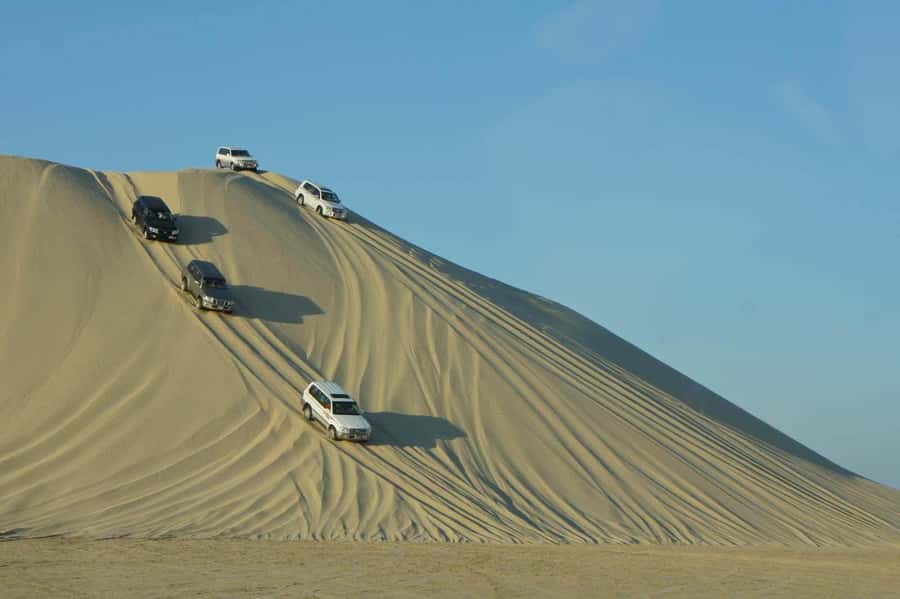 Doha: Desert Safari, Dune Bashing, Inland Sea With Transfers - Sealine Beach photo stop: a quick coastal breather