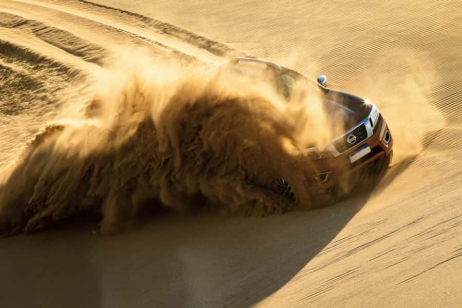 Doha Desert Safari: Sandboarding, Camel Ride & Swimming Fun - Extreme Dune Bashing in a 4x4: Fast, Skilled, and Real
