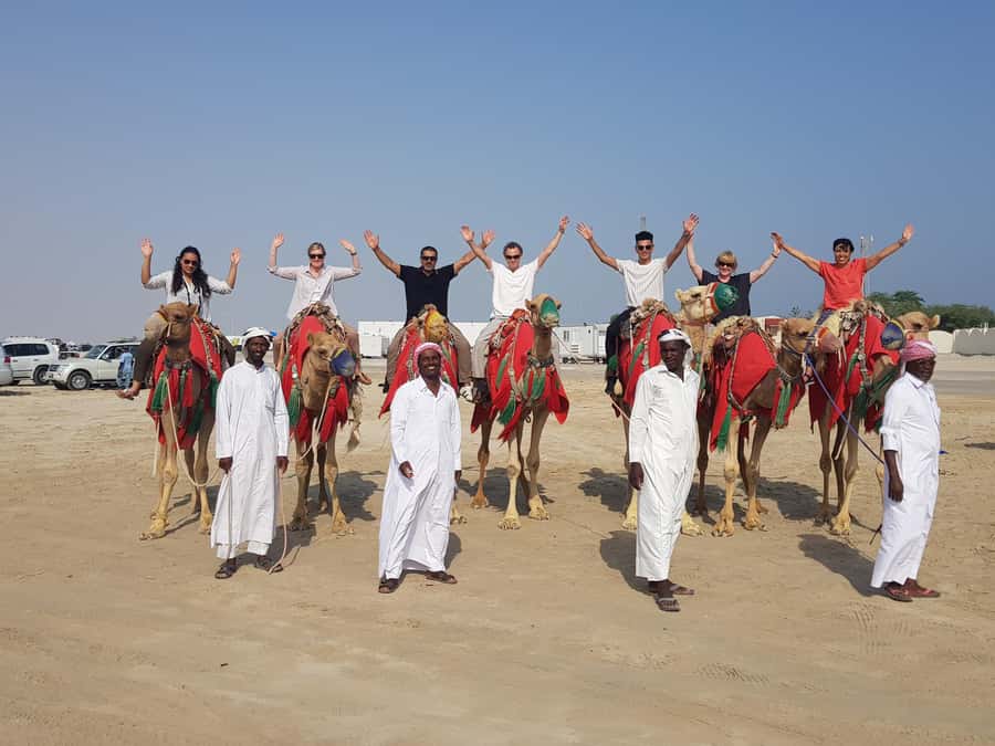 Doha: Desert Safari with Camel Ride Family Friendly Tour - Inland Sea (near the Saudi border): sunset views, a walk, and swimming