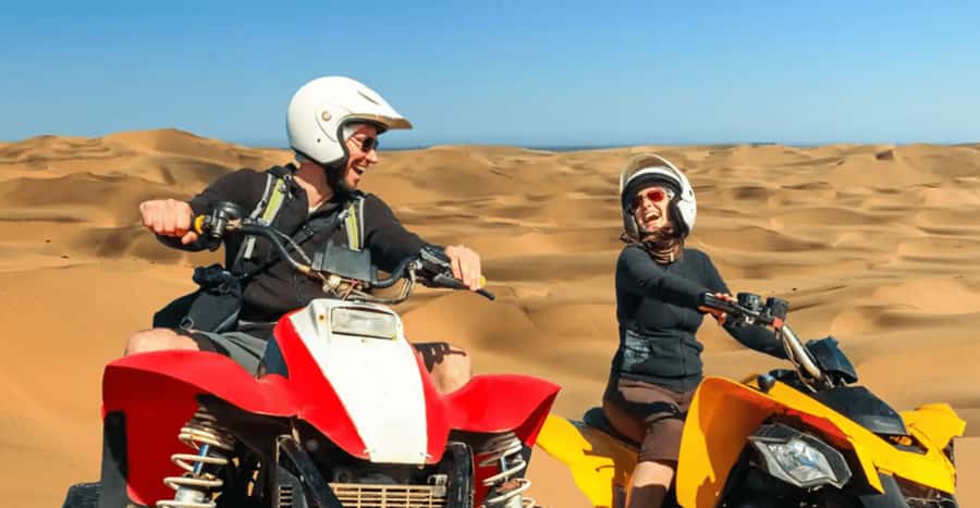 Doha: DesertSafari with Quad Bike, Camel Ride & Sandboarding - Sandboarding down golden dunes: fun, fast, and very camera-friendly