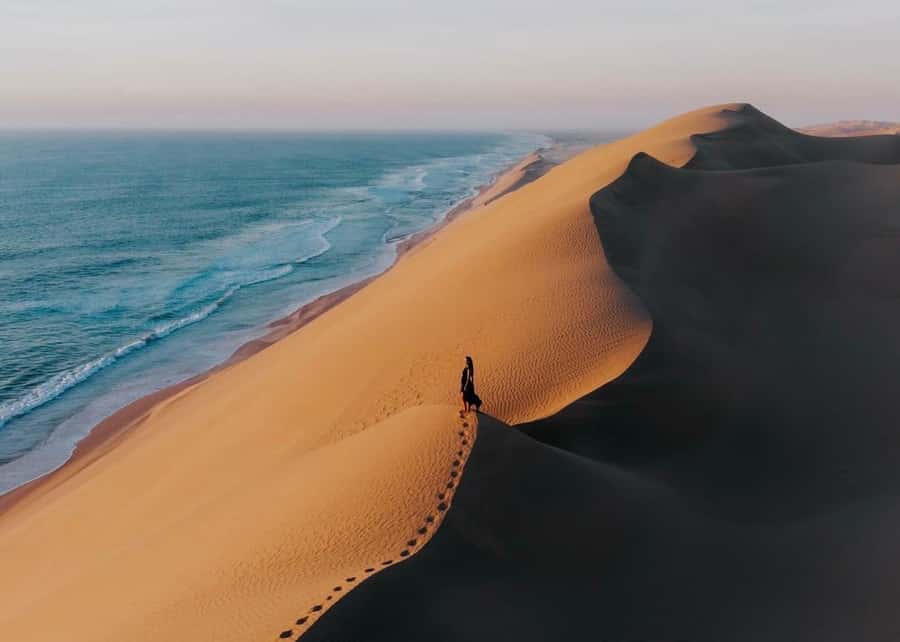 Doha: Inland Sea Desert Safari with Sunset & Sunrise Views - Sandboarding and beach time at Inland Sea Beach