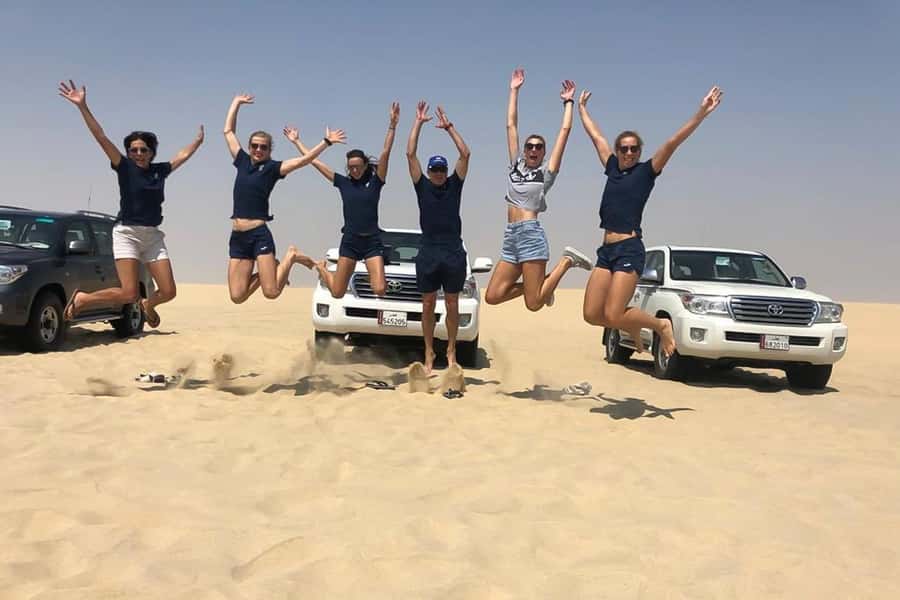 Doha Safari: ATV Ride, Dune Bashing, & Sandboarding Fun - The drive out of Doha: oil refineries to open sand