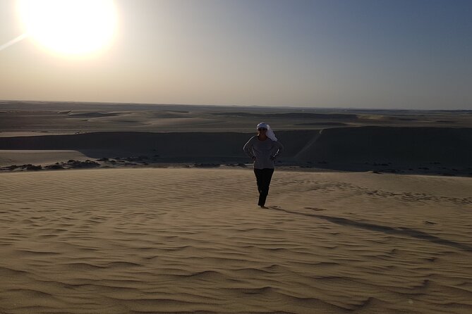 Doha: Sunrise /Sunset Desert Safari with Sand Boarding,Camel ride - Khor Al Udaid (Inland Sea): Where Wildlife Dreams Meet Real Sand