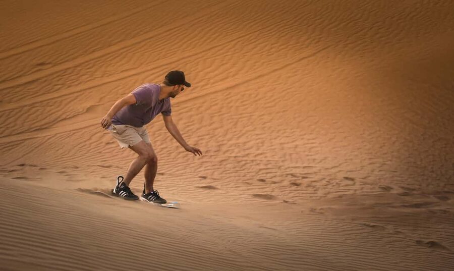 Doha: Sunset Desert Safari, ATV, Camel Ride and Sandboarding - Camel ride in Doha desert: short, scenic, and not the main event