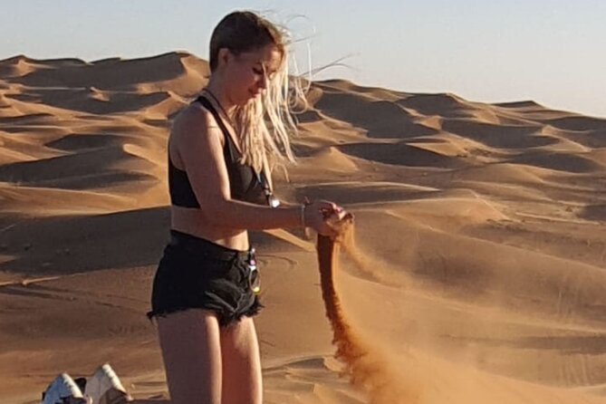 Dubai Desert Safari & Buffet Dinner and Camel ride with PRIVATE CAR - Sandboarding and sunset photos: turning adrenaline into memories