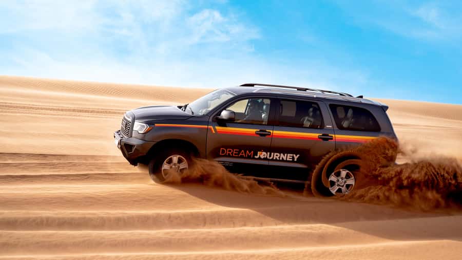 Dubai Desert Safari - Camel Ride, Sandboarding & 30 Min Quad - The Desert Base Moment: Tire Deflation, Photos, and Camel Time