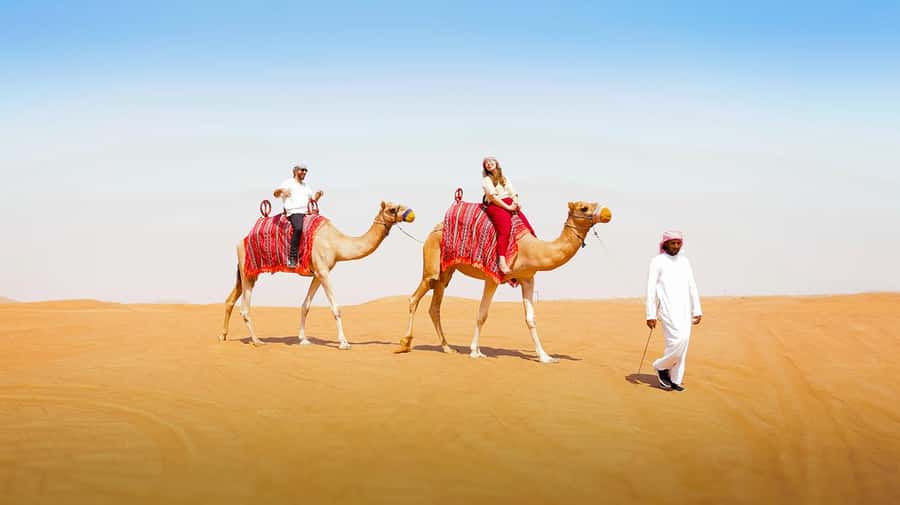 Dubai: Desert Safari, Camel Ride, Sandboarding, Quad Bike - Camp time, BBQ, and traditional dance: where the day rests
