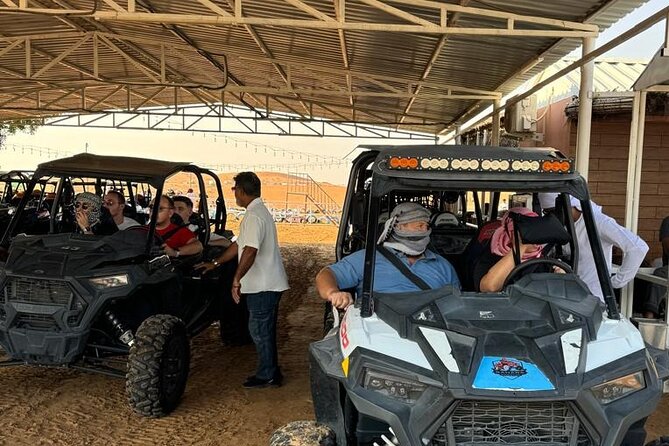 Dubai Desert Safari Dune Bashing, Camel Ride, Sandboarding & BBQ - The Bedouin-inspired camp: BBQ buffet and live fire, Tanura, belly dance