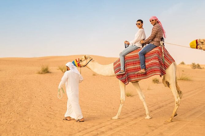 Dubai Desert Safari: Quad Bike, Camel Ride and BBQ Dinner - Dune Bashing in Land Cruisers and Sandboarding: Thrill With a Script