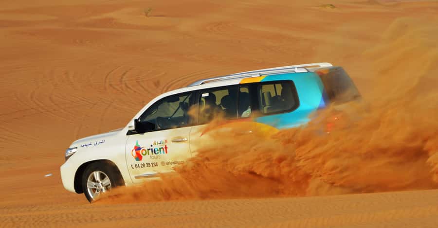 Dubai Desert Safari, Quad Biking, Camel Ride, & Sandboarding - Pickup and the Land Cruiser Ride: Getting to Lahbab Desert
