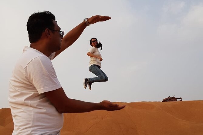 Dubai Desert Safari: Tanoura Show, Dune Bashing and BBQ Dinner - 4x4 dune bashing and sandboarding: adrenaline with real scenery
