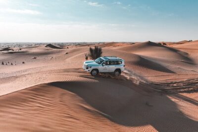 Dubai Desert Safari Thrill: Camel Ride, Live shows, BBQ & Spirits - Sunset at the highest point: when the dunes turn gold
