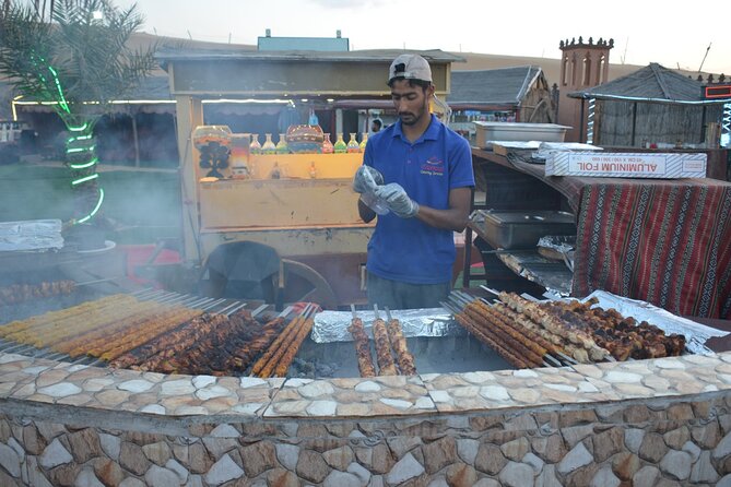 Dubai Desert safari Tour with Live BBQ & Belly Dance Shows - Al Aweer Camp: Camel Rides, Henna, and Shisha