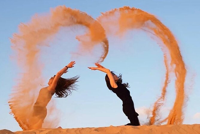 Dubai Desert Safari with BBQ And 4W Land Cruiser Dune Bashing Experience - Henna, traditional dress, and sunset photography moments
