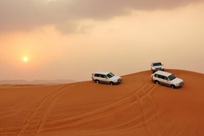 Dubai Desert Safari with BBQ Dinner, Camel Ride, and Shows - Sandboarding and the sunset photo stop you’ll actually use
