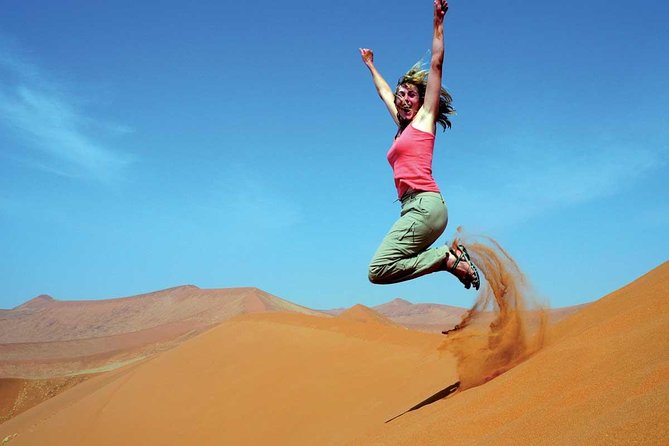 Dubai Desert Safari with BBQ Dinner, Camel Ride, and Shows - Shows under the stars: Tanoura, belly dance, and fire