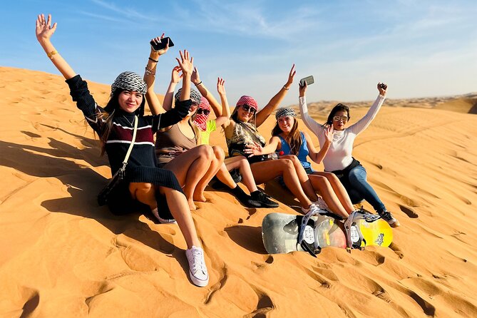 Dubai Desert Safari with BBQ Dinner & Shows from Ras Al Khaimah - Sunset Stop: Sand Boarding and Photo Time in the Changing Light
