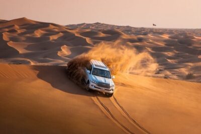 Dubai Desert Safari with Camel Ride, Sand surf, & BBQ Dinner - Red Dunes Drive and the Fun Part: Dune-Bashing Energy