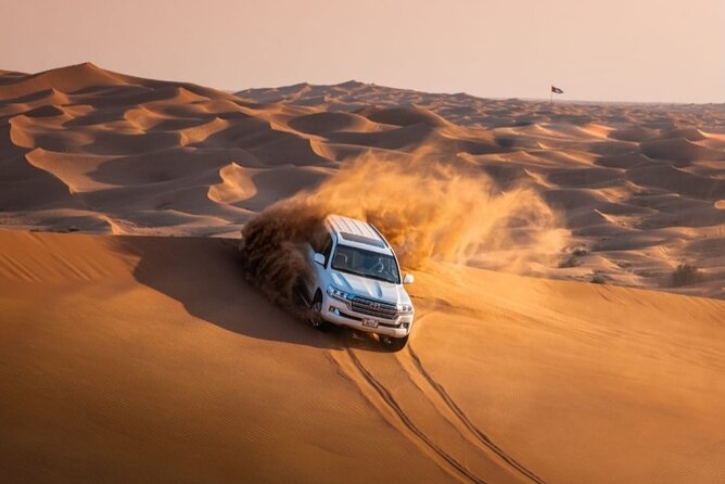 Dubai Desert Safari with Camel Ride, Sand surf, & BBQ Dinner - Red Dunes Drive and the Fun Part: Dune-Bashing Energy
