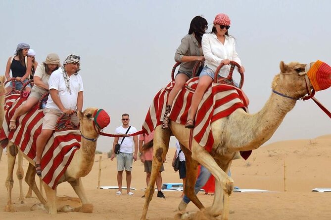 Dubai Desert Safari with Dinner, Camel Ride & Dune Bashing - Cultural Shows: Belly Dance, Tanoura, and Fire in One Evening Package