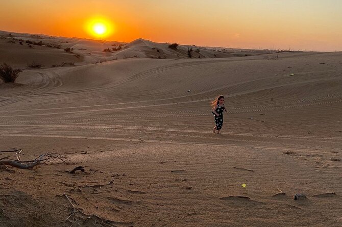 Dubai Desert Safari With Dune Bashing, Camel Ride & BBQ Dinner - Camel ride, henna for kids and ladies, and sandboarding at camp