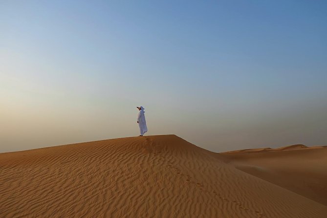 Dubai Desert Safari with Dune Bashing, Camel Rides & BBQ - BBQ dinner under the desert sky, plus belly dance and tanoura