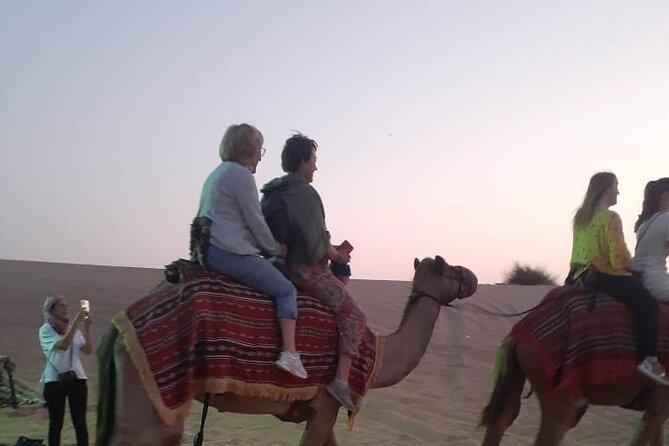 Dubai Desert Safari with Quad Bike, Camel Ride, Dinner and Shows - Traditional dress and photo moments in the desert camp