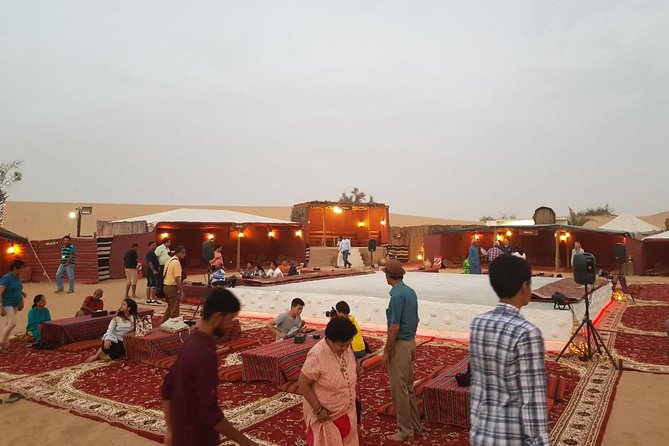 Dubai Desert Safari with Quad Bike, sandboarding, live show & BBQ - Live shows and BBQ dinner: belly dance, fire, and tanura-style night