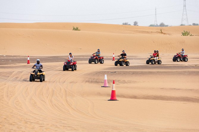 Dubai Desert Safari with Quads, BBQ Dinner, Camel ride, & Shows - Bedouin-Style Welcome: Coffee, Dates, Shisha, Henna, and Sand Art