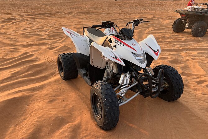 Dubai Evening Red Dune Safari With 30 Mins ATV, BBQ, Live Shows - Camp time: sunset viewing, sand boarding, and camel rides