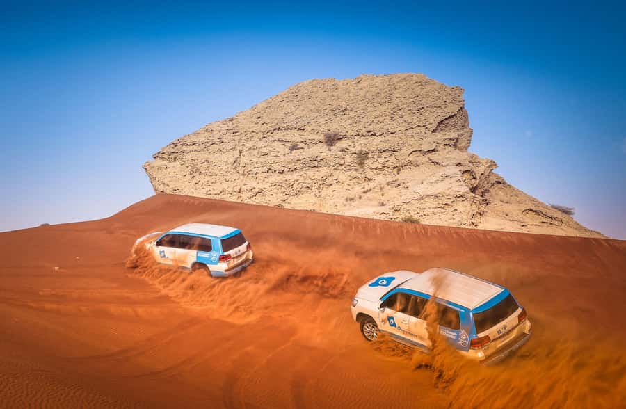 Dubai: Half-Day Desert Safari, Camel Ride, ATV & Dune Buggy - Sandboarding at Lahbab: the easiest way to feel like a kid